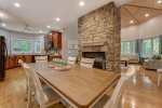 Dining Area with Double-Sided Gas Logs Fireplace